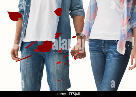 Image composite du hip young couple holding hands Banque D'Images