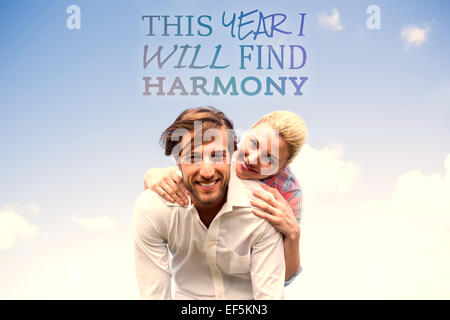 Image composite de handsome man giving piggy back pour sa petite amie Banque D'Images