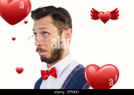 Image composite de hipster geek wearing christmas vest Banque D'Images