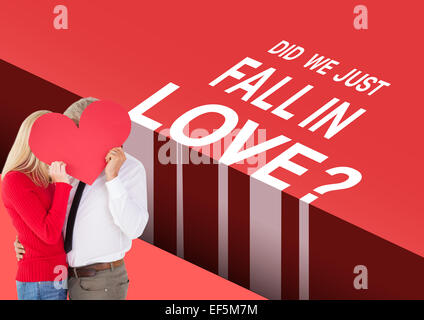 Image composite de bel homme d'obtenir un formulaire de carte de coeur femme Banque D'Images