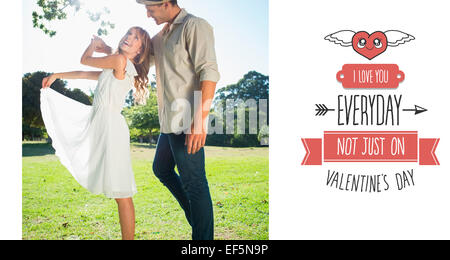 Image composite de cute couple dansant dans le parc et de rire Banque D'Images