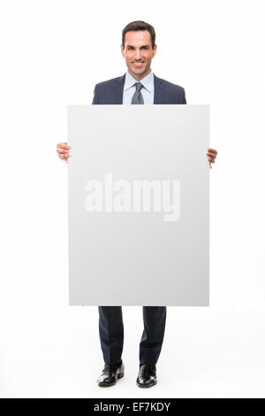 Portrait of a smiling woman holding a placard blanc Banque D'Images