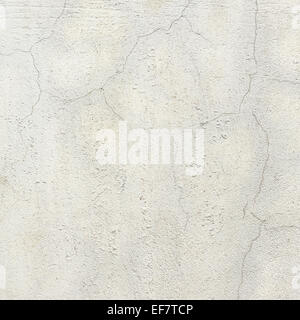 Mur peint en blanc en béton fissuré Banque D'Images