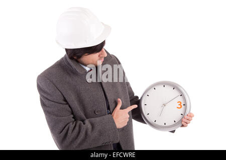 Habillé pour l'hiver ingénieur titulaire d'un réveil Banque D'Images