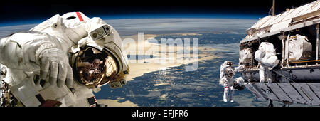 Une équipe d'astronautes effectuant des travaux sur une station spatiale en orbite autour de la Terre. La région Baltique apparaît ci-dessous comme le soleil Re Banque D'Images