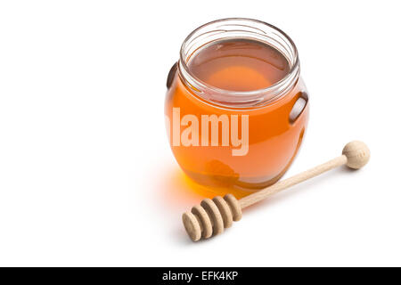Dans un pot de miel sur fond blanc Banque D'Images