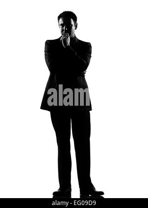 Silhouette caucasian business man thinking pensive comportement exprimant toute la longueur sur studio isolé sur fond blanc Banque D'Images