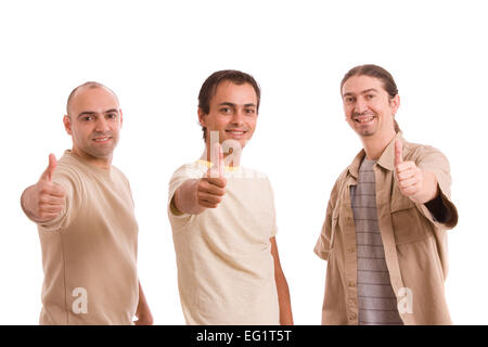 Groupe d'amis showing Thumbs up, isolé sur fond blanc Banque D'Images