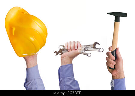 Travailleur homme's hand holding divers métiers outils du commerce. Partie d'une série d'images avec des outils de bricolage pour la maison de l'emploi et de l'artisanat Banque D'Images