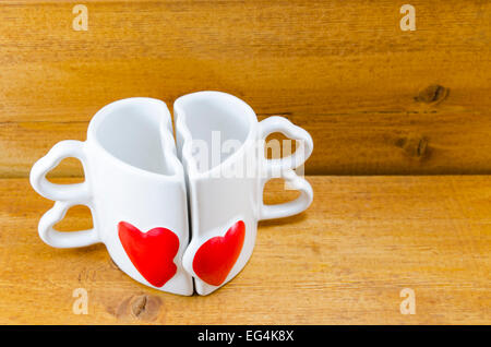 Tasse à café en forme de coeur qui peut être divisé en deux parties Banque D'Images