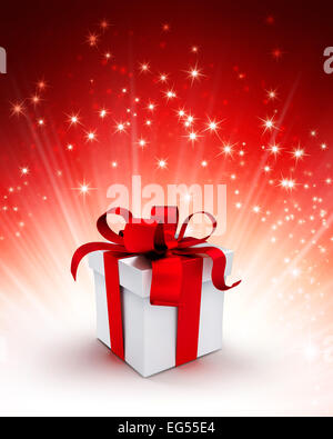 Boîte cadeau blanc enveloppé de rubans rouges sur un fond rouge scintillant Banque D'Images