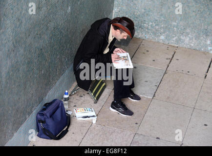 Artiste de rue, assis dans un métro dans le quartier de Belém de Lisbonne Banque D'Images