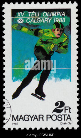 Hongrie - circa 1987 : timbre imprimé dans la Hongrie affiche le patinage de vitesse, Jeux Olympiques d'hiver de 1988, Calgary, Canada, vers 1987 Banque D'Images
