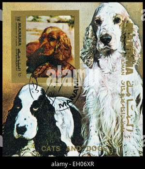 MANAMA - circa 1972 : timbres en Manama montre les chiens, vers 1972 Banque D'Images