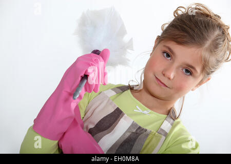 Petite fille avec duster Banque D'Images