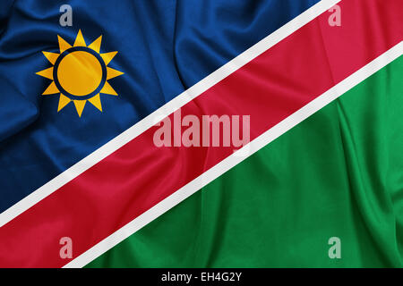 Namibie - agitant le drapeau national sur la texture de la soie Banque D'Images