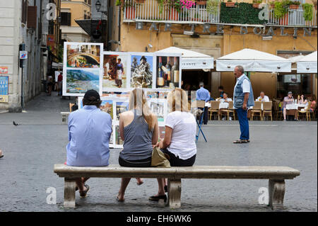 Peintures italiennes sur l'affichage à vendre sur une place de Rome, Italie. Banque D'Images