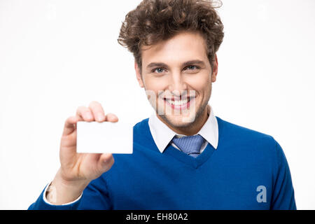 Smiling businessman showing blank business card Banque D'Images