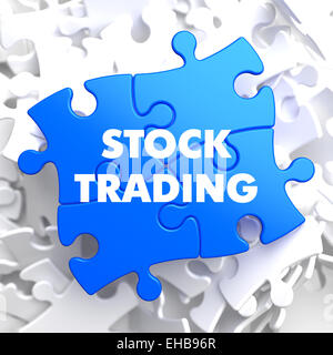 Stock Trading sur Puzzle bleu sur fond blanc. Banque D'Images