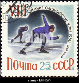 Urss - VERS 1960 : un post de timbres en URSS montre skaters Banque D'Images