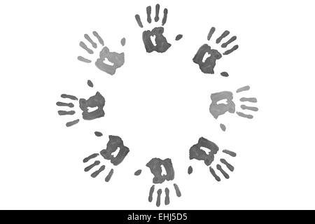 Des empreintes de main formant un cercle noir Banque D'Images