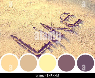 Palette de couleur comme mot sur le sable Banque D'Images