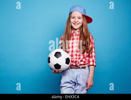 Smiling girl garder blanc noir ball Banque D'Images