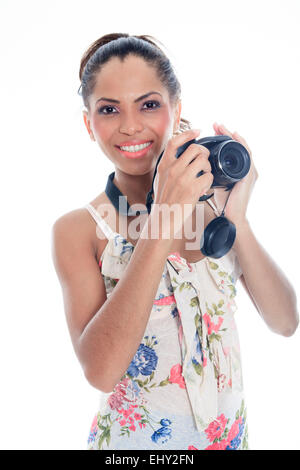 Girl-photographe prend s'enclenche, isolated on white Banque D'Images