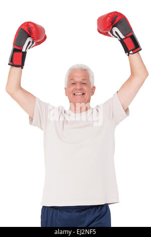 Senior man in boxing gloves Banque D'Images