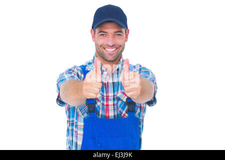 Portrait of happy homme réparateur gesturing Thumbs up Banque D'Images