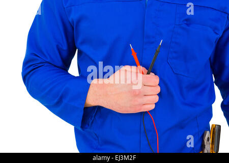 Electrician holding multimètre Banque D'Images
