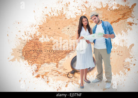Image composite de hipster perdu couple looking at map Banque D'Images