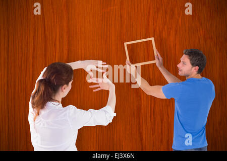 Image composite du couple de décider de suspendre photo Banque D'Images