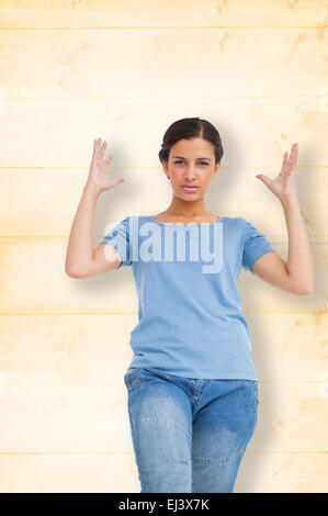 Image composite de l'ennuyé brunette gesturing Banque D'Images