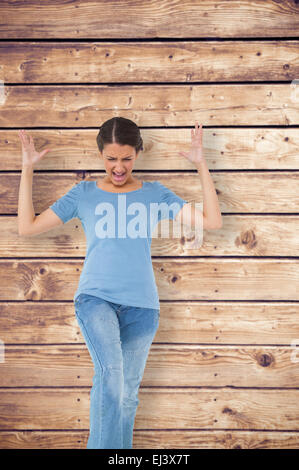 Image composite de l'ennuyé brunette gesturing Banque D'Images