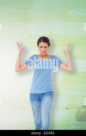 Image composite de l'ennuyé brunette gesturing Banque D'Images