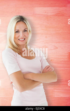 Composite image smiling with arms crossed Banque D'Images