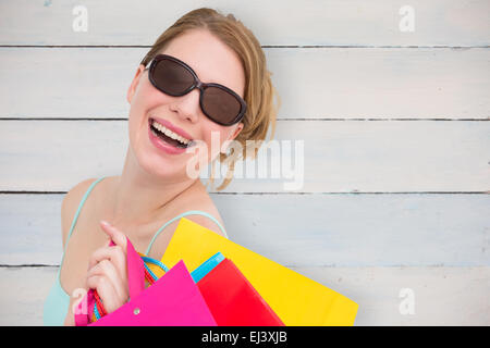 Composite image of woman wearing sunglasses Banque D'Images