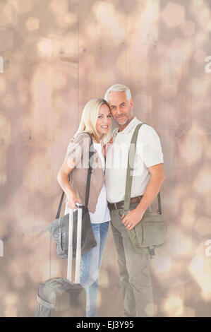 Image composite de l'heureux couple prêt à partir en vacances Banque D'Images