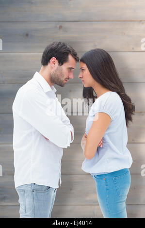 Image composite de angry couple facing off après l'argument Banque D'Images