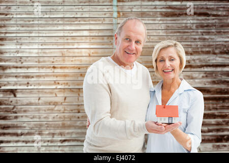 Image composite de couple avec model house Banque D'Images