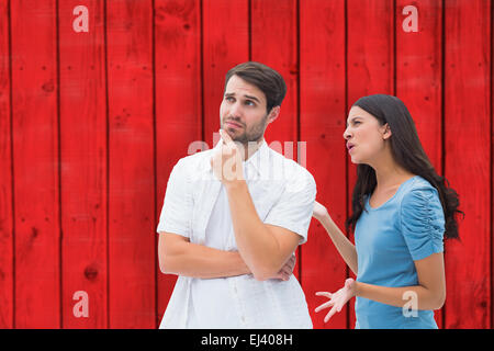 Image composite de angry brunette criant à petit ami Banque D'Images