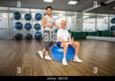 Composite image portrait of a happy fit couple Banque D'Images