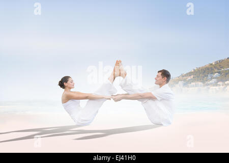 Image composite de la couple sitting in position bateau ensemble Banque D'Images