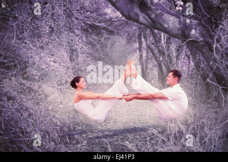 Image composite de la couple sitting in position bateau ensemble Banque D'Images