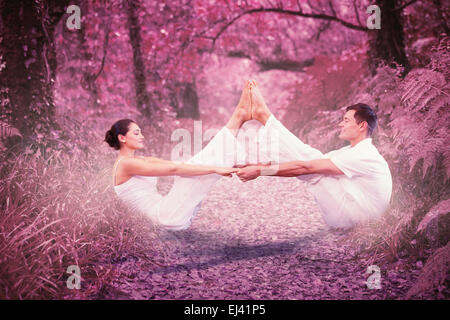 Image composite de la couple sitting in position bateau ensemble Banque D'Images