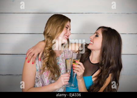 Image composite de friends drinking champagne Banque D'Images