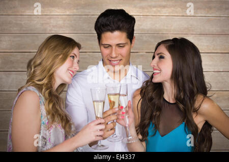 Image composite de friends drinking champagne Banque D'Images