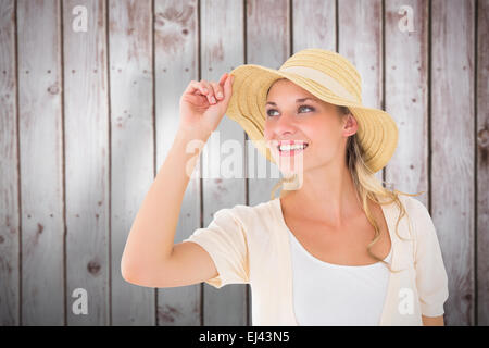 Composite image jeune couple smiling in sunhat Banque D'Images