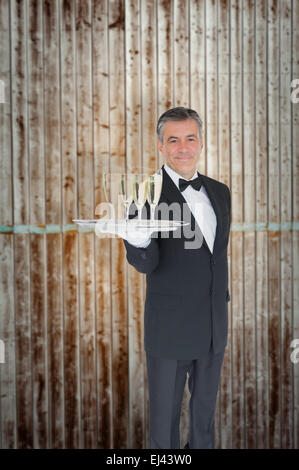 Image composite de waiter offering tray with glasses of champagne Banque D'Images